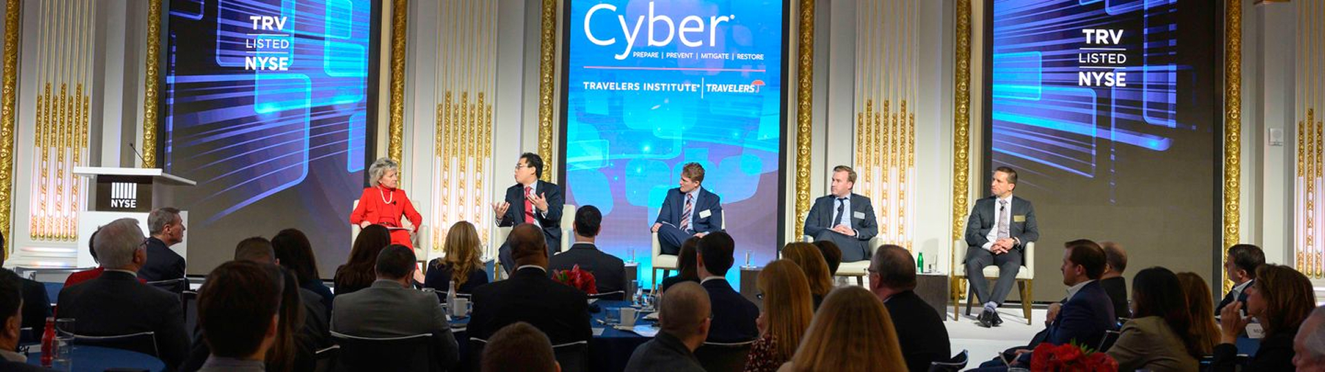 Joan Woodward, President of the Travelers Institute, is part of a seated panel with four other people
