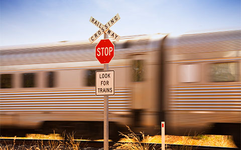 Train moving along railway crossing