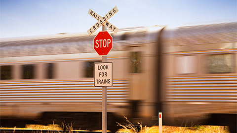 Train moving along railway crossing