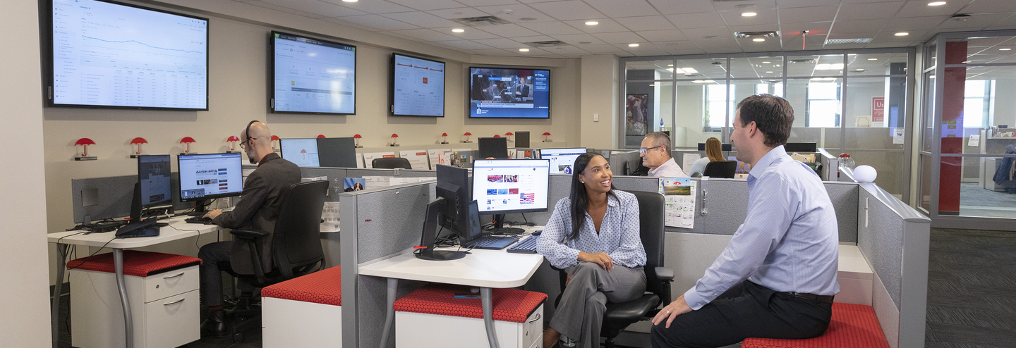 Man and woman talking in an office.