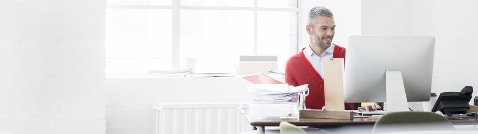 Man using TravPay on his business computer.