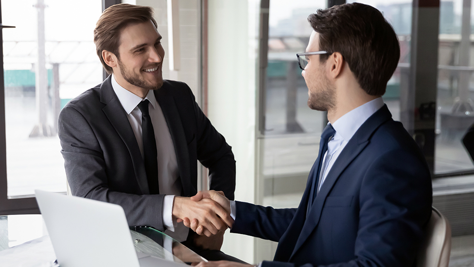 two businessmen shaking hands.