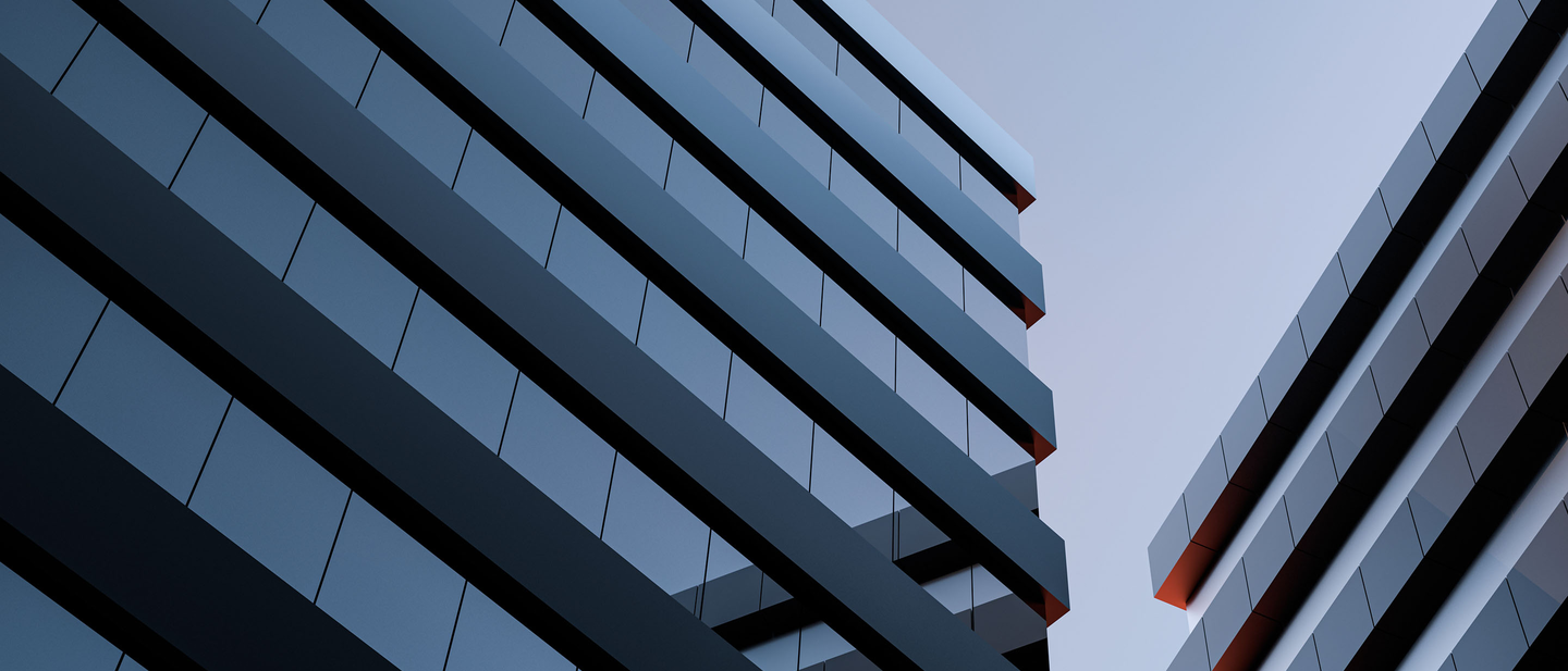 A skyward view of a two glass and steel constructed commercial properties. 