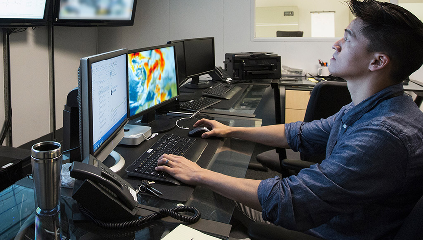 Man using technology to forecast weather.