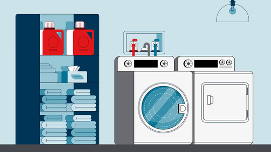 Washing machine and clothes dryer in the laundry room of a home.