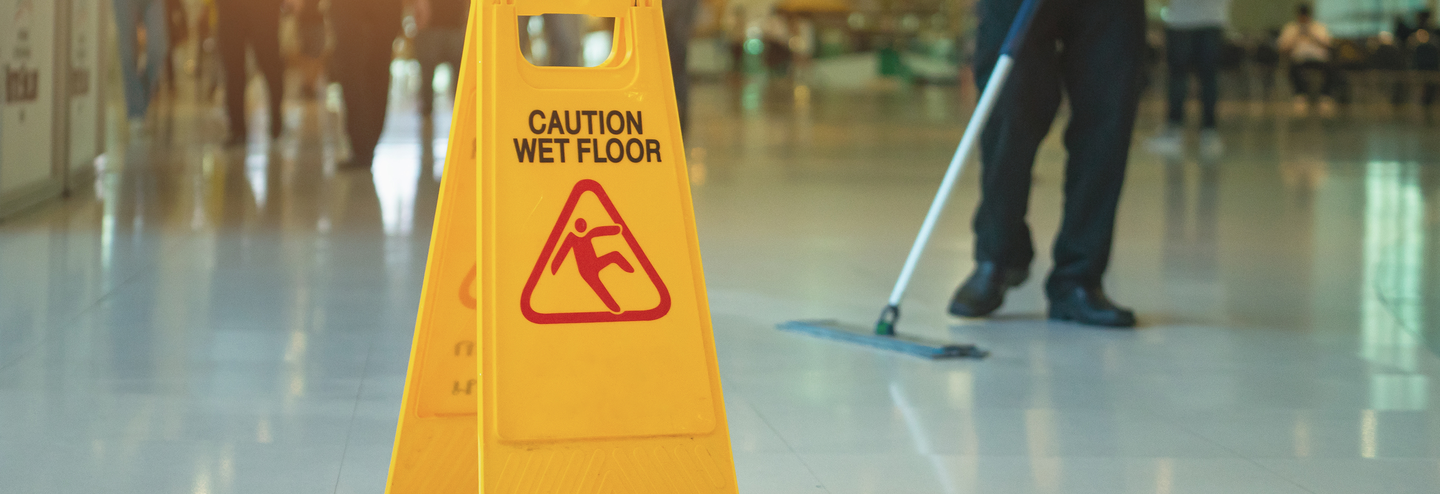 A yellow wet floor warning sign