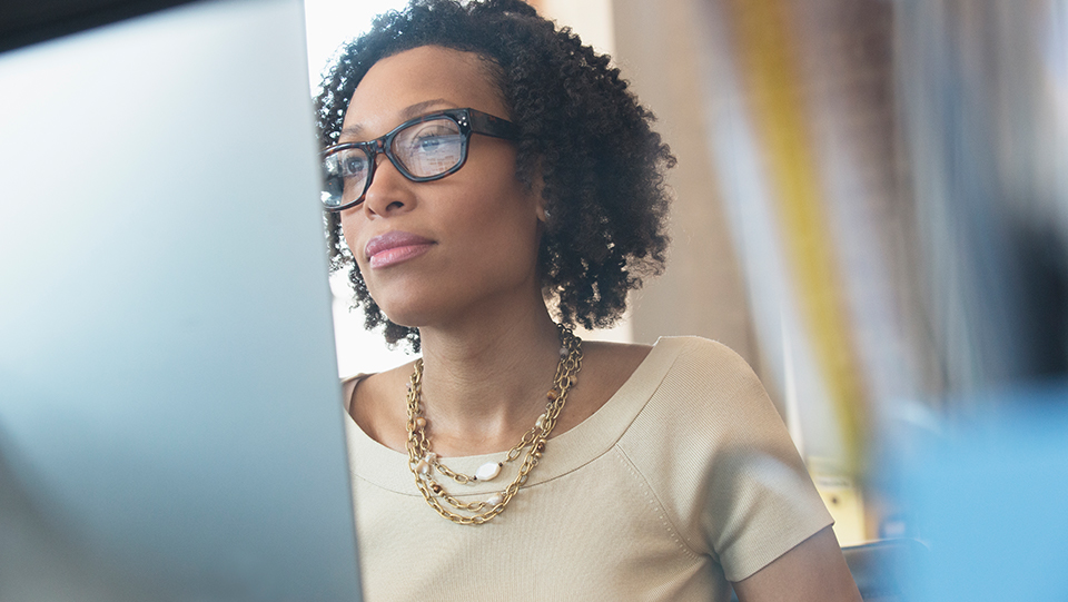 Woman looking at the computer screen.