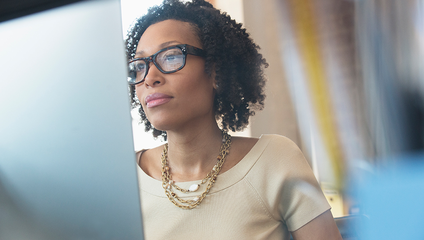 Woman looking at the computer screen.