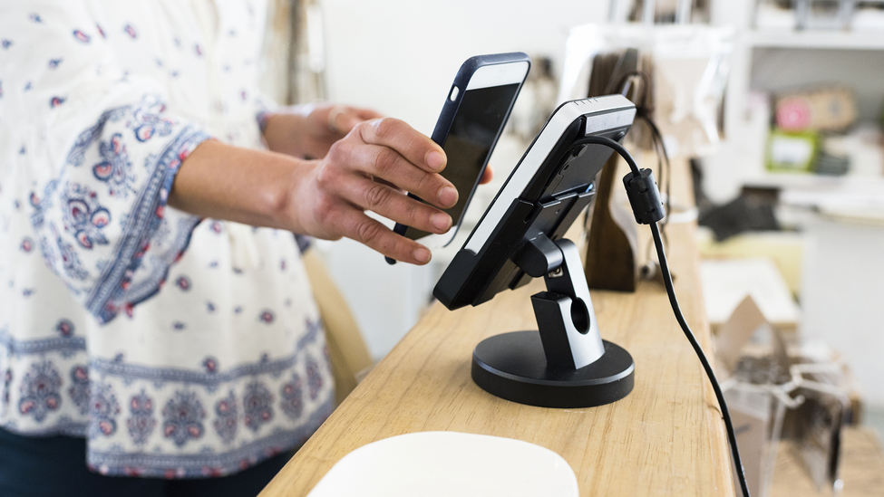 Woman using contactless payment