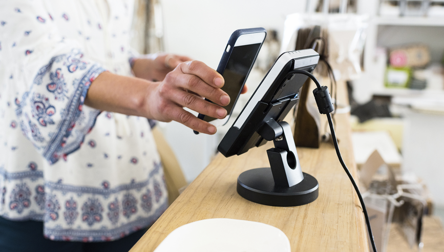 Woman using contactless payment