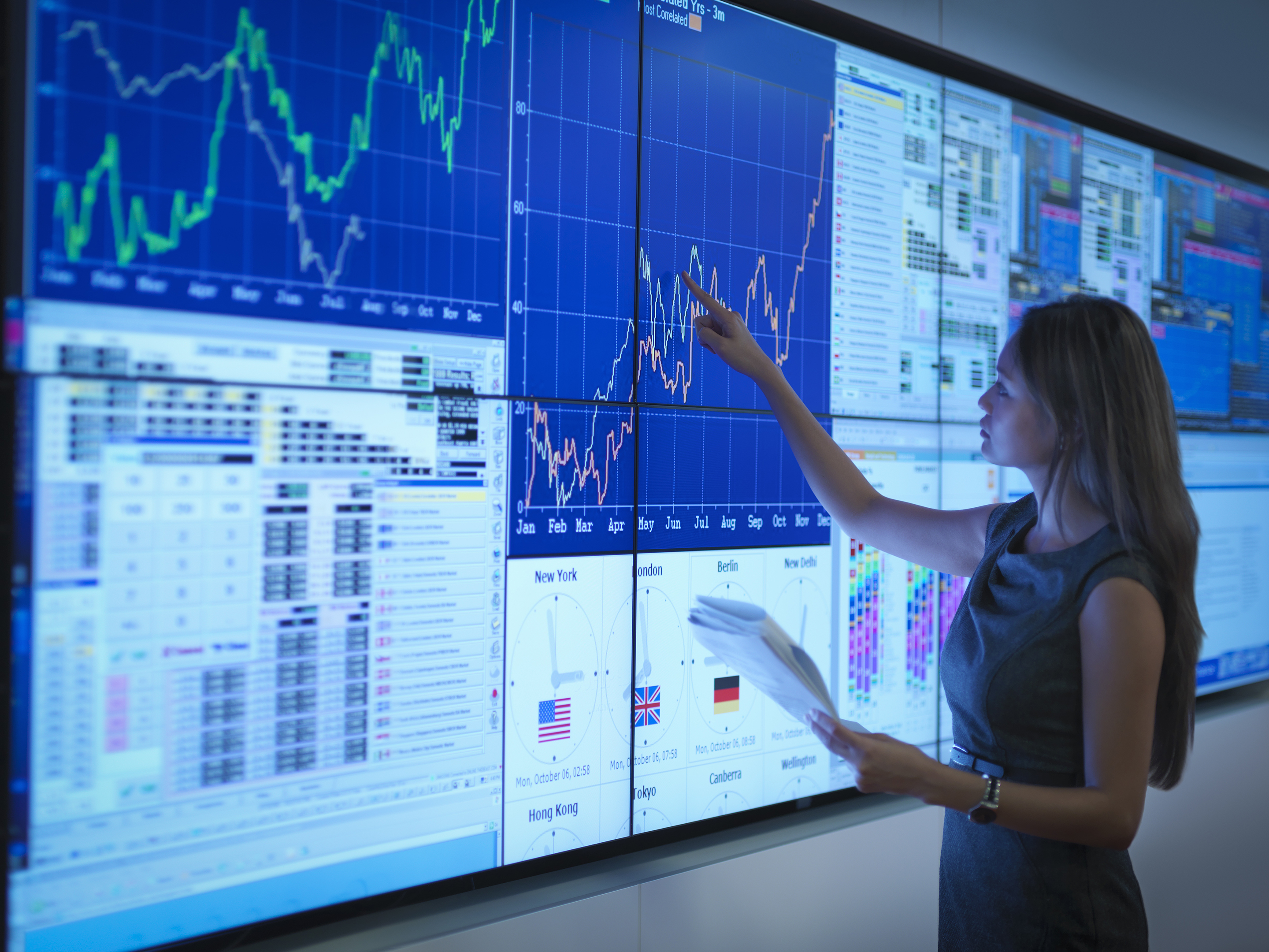 Woman analyzing data on a large screen