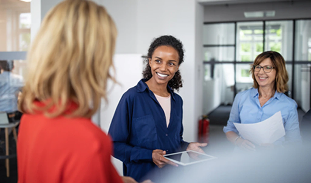 Woman meeting with loss consultant to determine whether to file a claim.