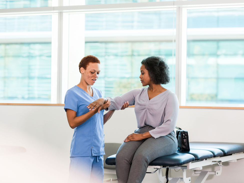 Patient receiving physical therapy treatment from physical therapist.