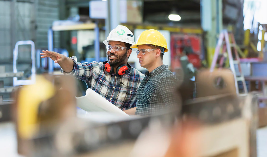 Workers discussing plans.