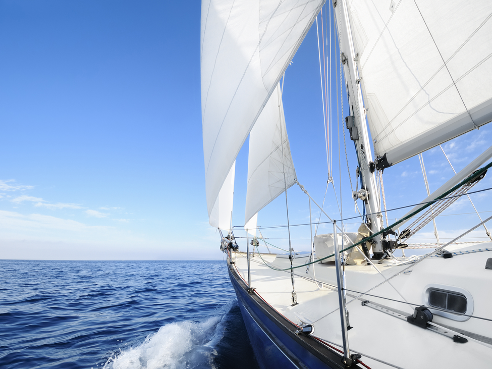 A sailboat sailing on a sea.